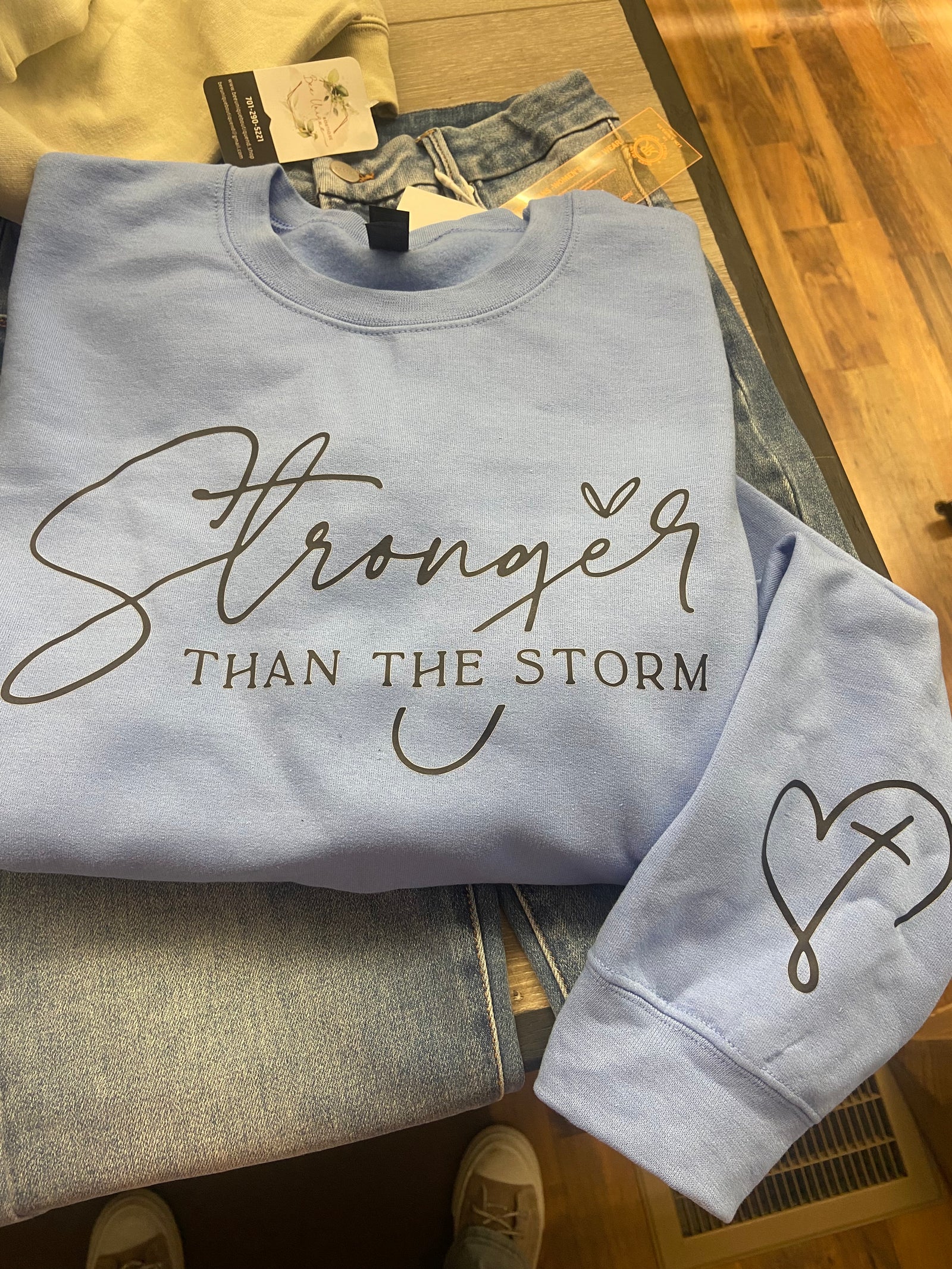 Stronger Than The Storm Graphic Sweatshirt